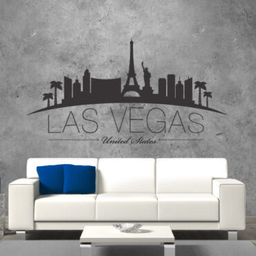 Primer izgleda črne samolepilne stenske nalepke Las Vegas zaviti na sivi steni nad sedežno v dnevni sobi. Na nalepki piše: Las Vegas, United Sates
